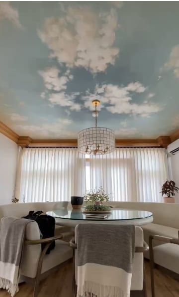 Sheer window coverings framing a bright breakfast nook — OM Design